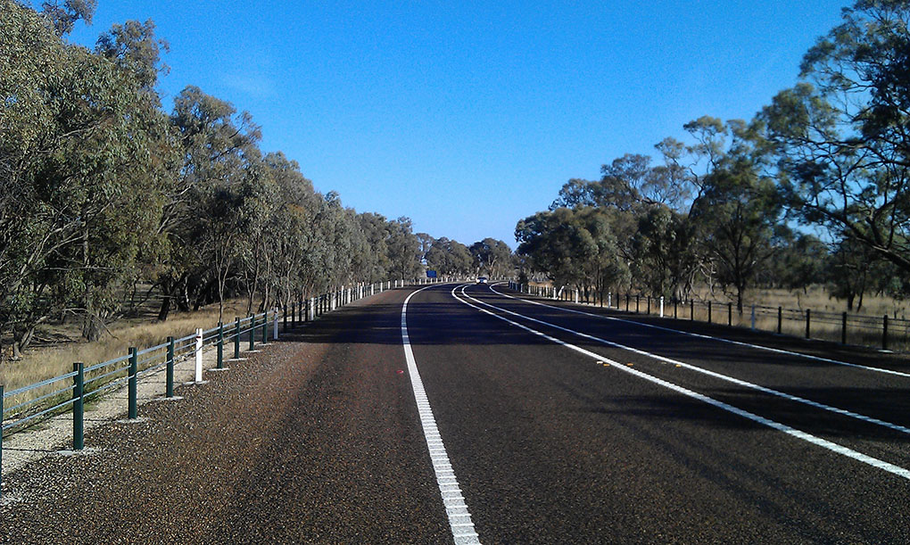 A wide centreline on Dukes Highway. Several white line markings are visible.