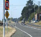 Rural road intersection with active warning system and channelised turn lanes